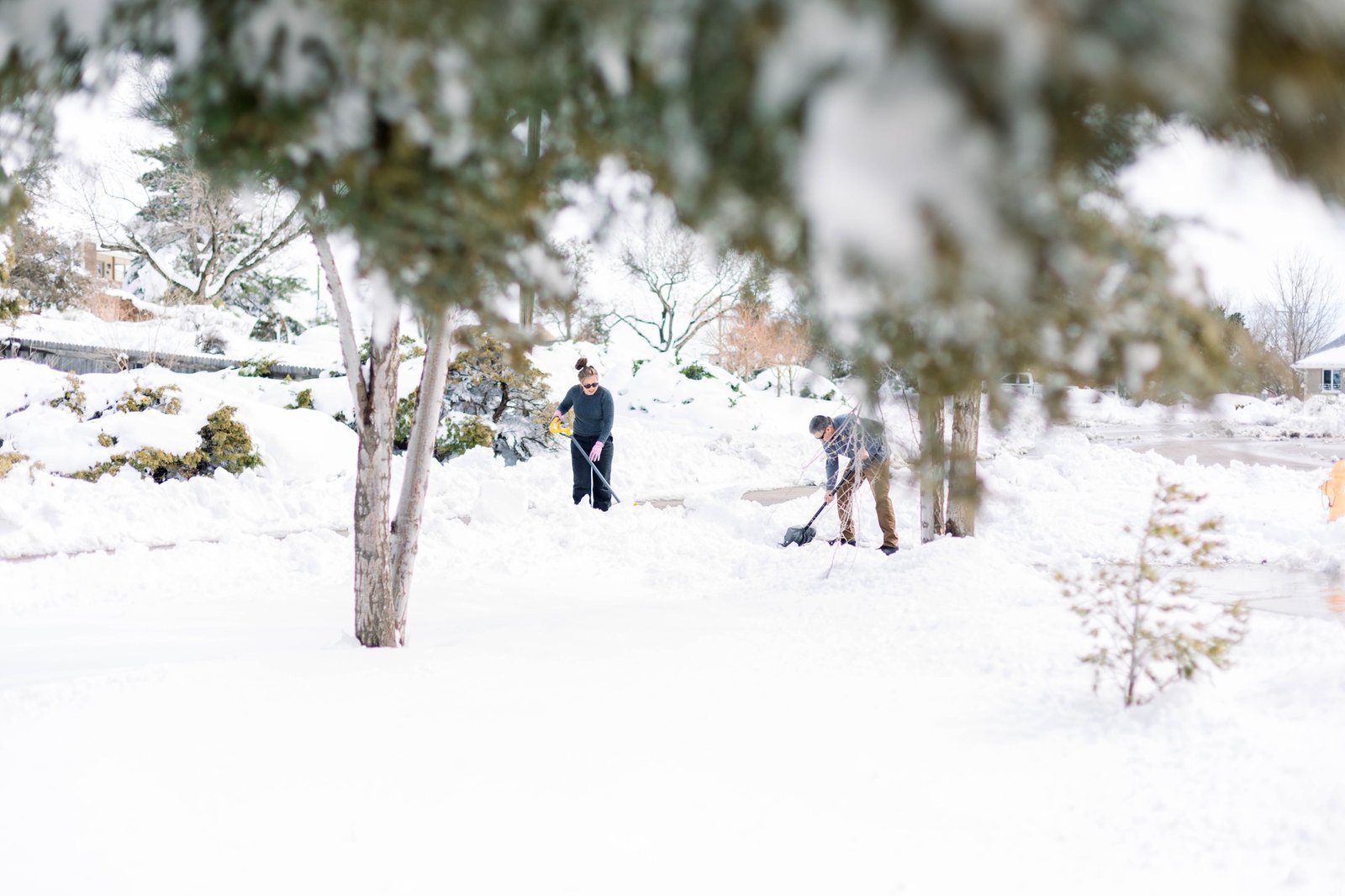 People shoveling snow after a snow storm